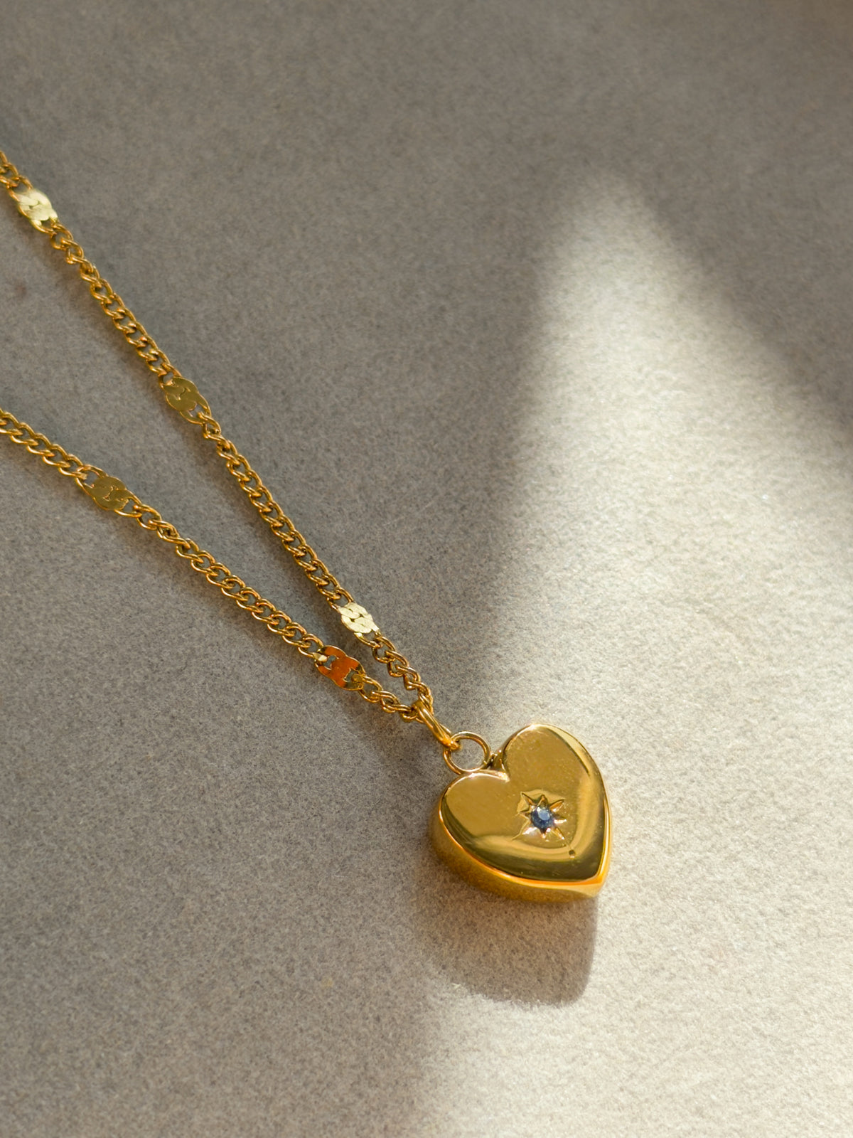 Gold Heart Pendant Necklace with Blue Crystal